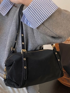 Retro black nylon shoulder bag with adjustable gold hardware for 2025 winter fashion