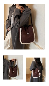 Detail of dark brown suede bucket bag with white fleece trim and silver metal lock