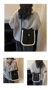 Close-up of contrast bucket bag with black matte texture and white plush fleece trim details