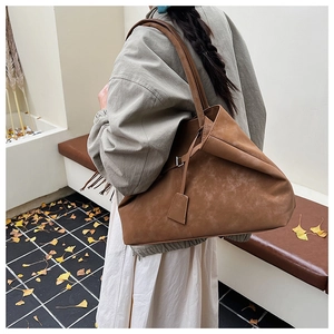 Brown suede tote bag for women showing large capacity and vintage shoulder bag style