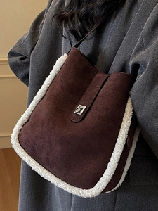 Winter minimalist bucket bag in brown suede and sherpa trim with silver metal clasp
