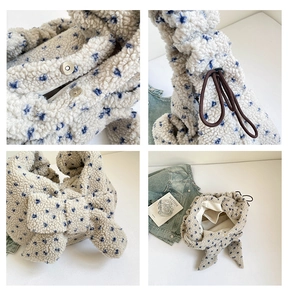 Detail of plush floral bag showing magnetic clasp, interior lining and drawstring handle