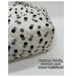 Detail of durable quilted fabric with polka dot pattern and scratch resistant texture