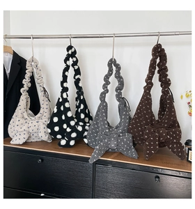 Macro shot of fluffy bow plush bags in four colors with ruffled shoulder straps