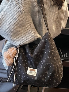 Retro grey canvas tote bag with white bow heart patterns and a plush bear pendant