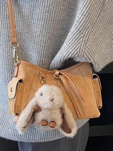 Retro tan suede crossbody bag for women with a cute plush rabbit pendant charm