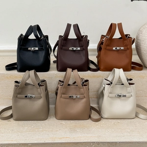 Selection of litchi grain leather bucket bags in six neutral colors with silver hardware