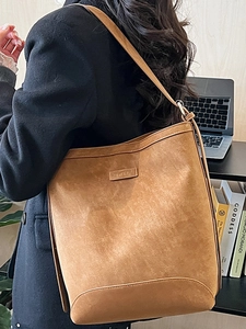 Minimalist brown suede leather shoulder bucket bag with logo for daily winter commute
