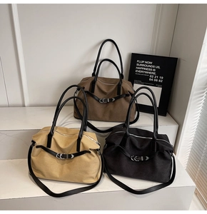 Three minimalist canvas tote bags in brown beige and black with leather straps