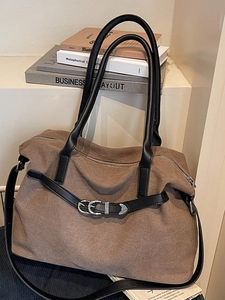 Retro brown canvas tote bag with black leather straps and metal buckles for commuting
