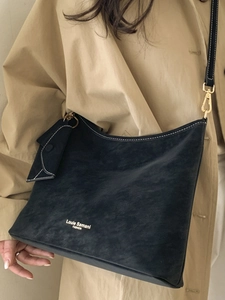 Retro black tote bag with white contrast stitching and matching envelope pouch bag