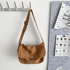 Urban minimalist tan canvas crossbody bag for women with adjustable shoulder strap