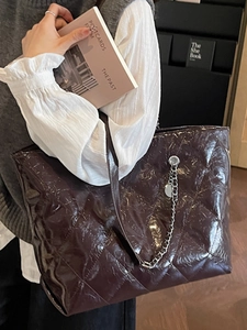 Chic quilted faux leather tote bag with silver chain accessory for casual commute