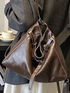 Large dark brown tote bag in glossy leather with contrast stitching and metal hardware