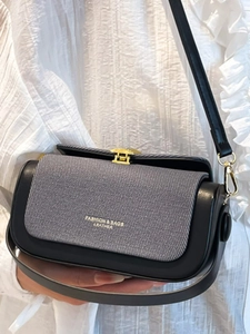 Minimalist square crossbody bag with grey woven flap and black leather frame