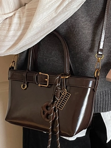 Retro dark brown crossbody bag with top handle and woven pendant for fashion women