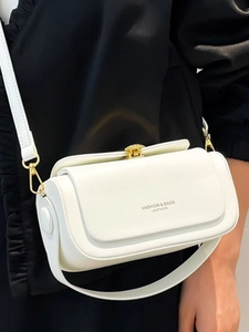 Minimalist white leather crossbody box bag for women with gold clasp and shoulder strap