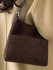 Retro dark brown suede bucket shoulder bag with V-shaped pocket and leather strap