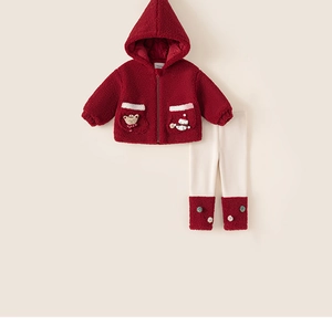 Close-up of winter fleece hooded jacket with cute teddy bear and snowman patches