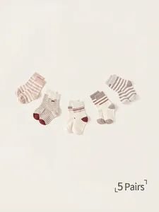 Set of 5 pairs of vintage kids mid-calf socks with retro knit patterns and soft tones
