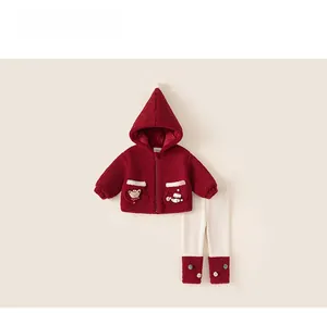 Detail of baby girl winter fleece hoodie and pants set with cute bear applique