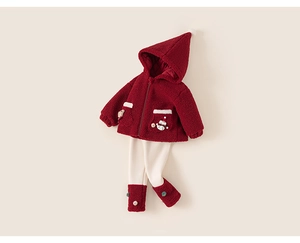 Detailed close-up of girls' red fleece hoodie with snowman embroidery and velvet pants