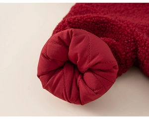 Detail of red fleece outer and diamond quilted lining on a warm kids winter outfit