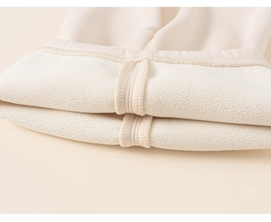 Detail of soft fleece lining on warm winter leggings with high-quality reinforced stitching