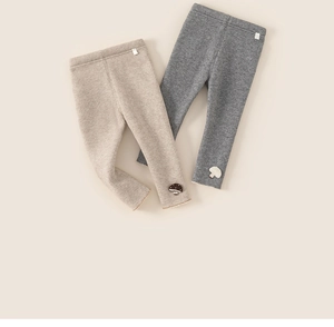 Close-up of ribbed knit toddler leggings with cute mushroom embroidery and elastic waist