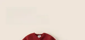 Close-up of deep red sherpa fleece jacket texture with detailed soft collar and inner label