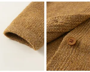 Detailed view of the ribbed cuffs and brown buttons on this caramel knit cardigan