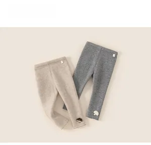 Close-up of ribbed knit thermal leggings for girls with cute 3D mushroom patches
