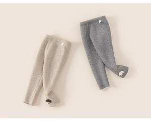 Detail view of ribbed knit texture and mushroom patch on these warm toddler leggings