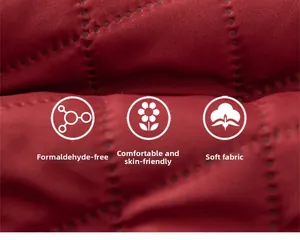 Detailed close-up of soft red quilted fabric texture with comfortable skin-friendly feel