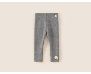Detail shot of grey ribbed knit leggings for toddlers with cute mushroom patch applique