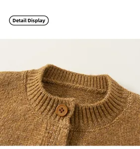 Detailed close-up of brown knit cardigan collar with rib-knit pattern and dark button