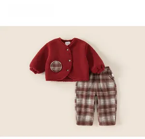 Detailed flat lay of children's winter burgundy fleece jacket and brown plaid pants set