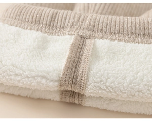 Close-up of girls warm thermal leggings with shiny knit fabric and thick fleece lining