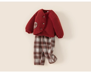 Detail of red fleece jacket with heart pocket and matching brown plaid pants set