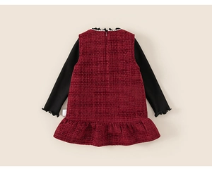 Detail of tweed dress showing white pearl neckline and ruffled hem for girls