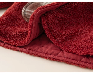 Macro detail of wine red polar fleece fabric with premium quilted lining for kids