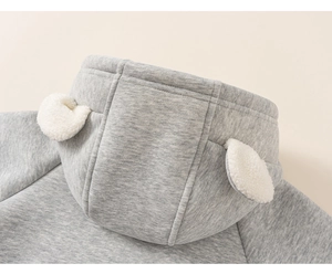 Detailed close-up of grey toddler hoodie with cute white plush animal ears on hood