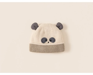 Detailed view of panda embroidery and soft knit texture on cream baby winter hat