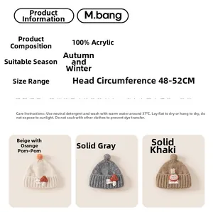 Detail view of colorful knit hats with pom-poms and cute cartoon patches in warm autumn tones