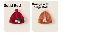 Detail view of red mushroom and orange bunny knitted kids hats with soft pompoms