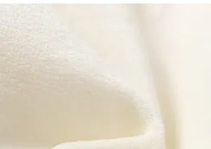 Detailed close-up of soft white fleece fabric texture for kids princess dress