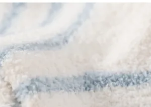 Detail of soft striped plush fabric in light blue and cream white for baby socks