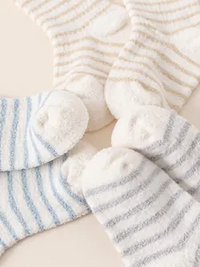 Striped coral fleece warm socks for toddlers in blue, grey, and beige plush material