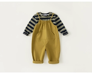 Close-up of baby striped long-sleeve tee and khaki suspender pants set for boys