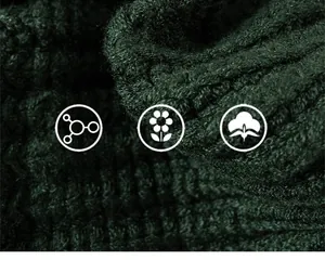 Detail showing the thick dark green knitted fabric with vertical ribbing for warmth